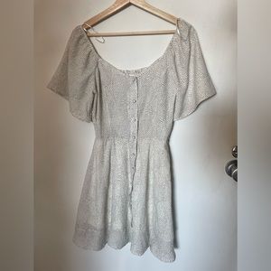 Tags on white dotted dress